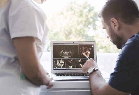 Male And Female Dentist Looking At Xray